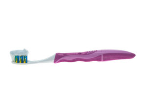 A toothbrush and toothpaste - white background