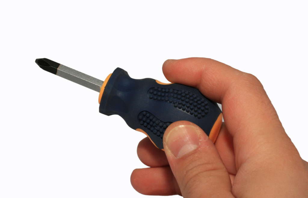 A small screwdriver with a metal driver and plastic handle; demonstrating a use of the insert molding process