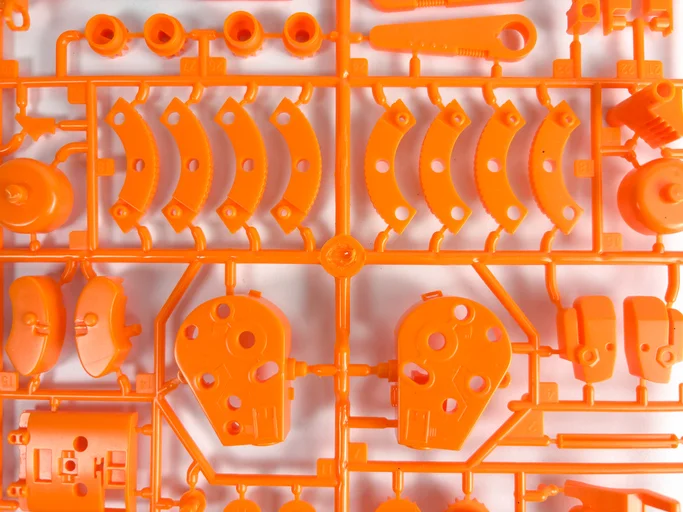 An orange plastic sprue kit.