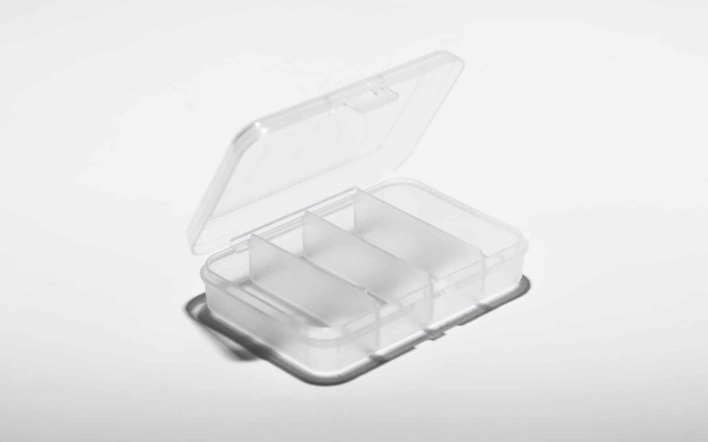 Pill case with living hinge