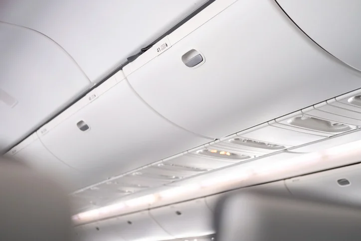 The overhead compartments on an airplane.