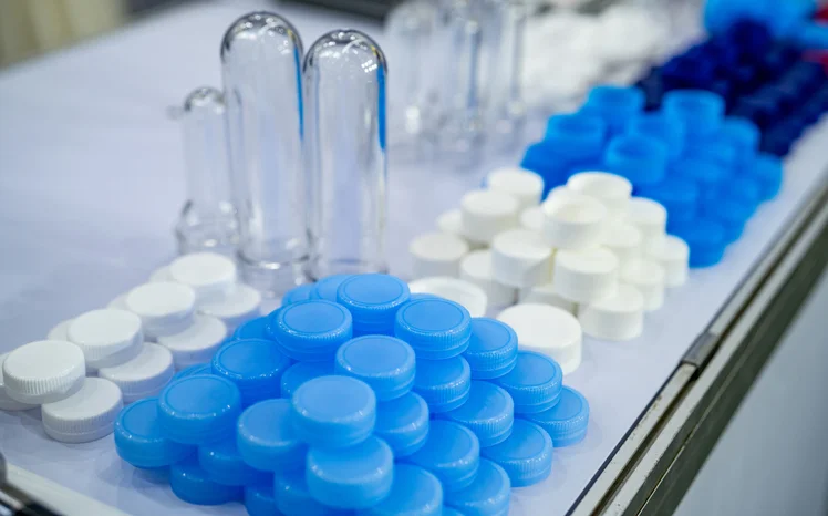 Plastic bottles and caps lined up nicely after being manufactured.