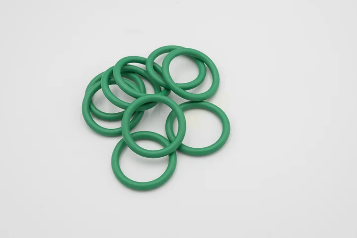 Green o-rings on a white background.